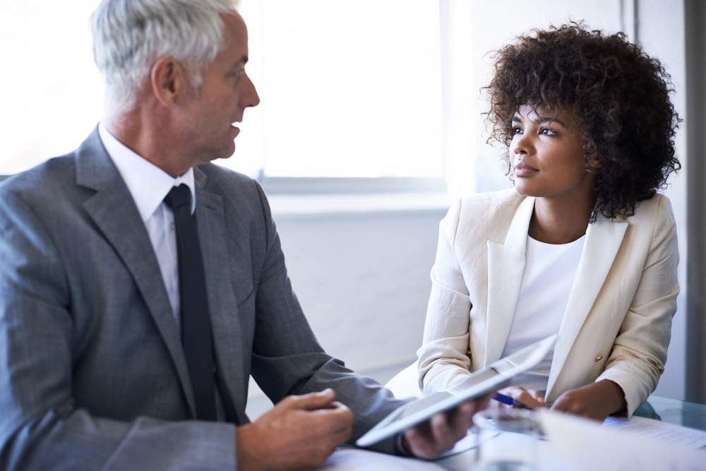Two business people in discussion.