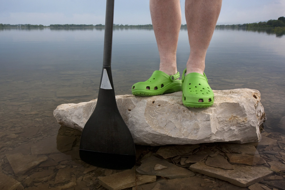 Image of a person wearing crocs.
